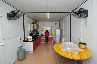Illustration for article titled China's "Cabinet Tribe" Lives in Shipping Containers
